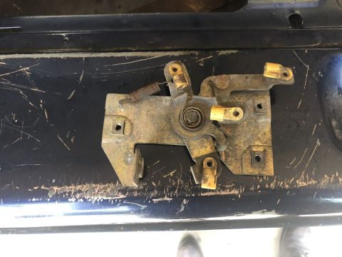 1995 Ford Bronco - Close-up of a tailgate latch mechanism, likely for a Ford Bronco.