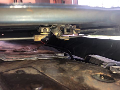 1995 Ford Bronco - Close-up view of the tailgate latch mechanism and associated cables.