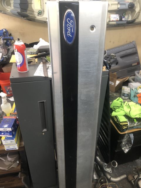 1995 Ford Bronco - Ford tailgate panel with blue oval Ford logo, likely for a Bronco or F-Series truck.