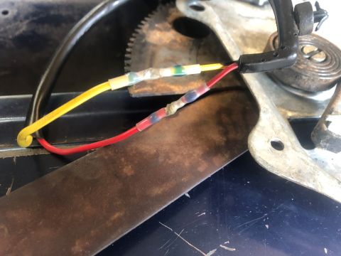 1995 Ford Bronco - Wiring connections on a mechanical component, possibly for a vehicle's power window system.