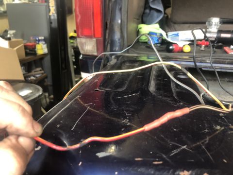 1995 Ford Bronco - Wiring repair in progress on the tailgate of a 1995 Ford Bronco.