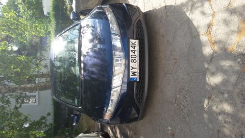 Blue sedan front view with license plate WY 8044K
