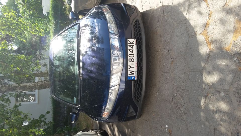 Blue sedan front view with license plate WY 8044K