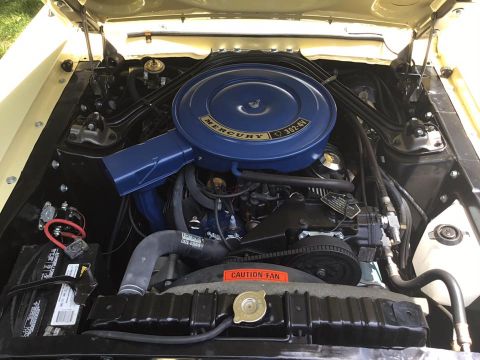 1968 Mercury Cougar - The engine bay of a 1968 Mercury Cougar is shown, highlighting the air cleaner and engine components.