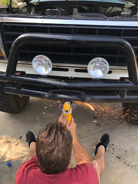 1981 Ford Bronco - Modifying the front bumper of a truck, likely a Ford Bronco from the early 1980s.