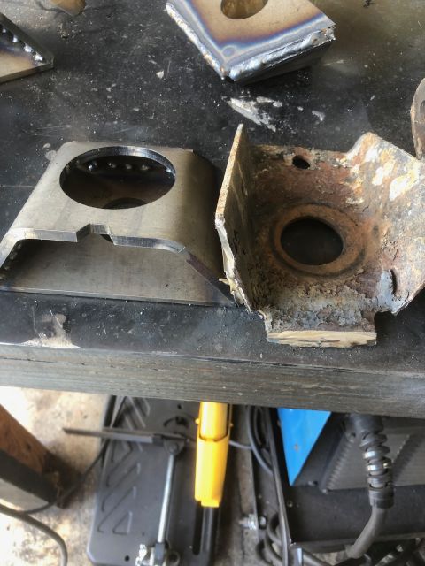 1992 Jeep Wrangler - Comparison of a new metal frame part next to a heavily corroded and damaged old part.