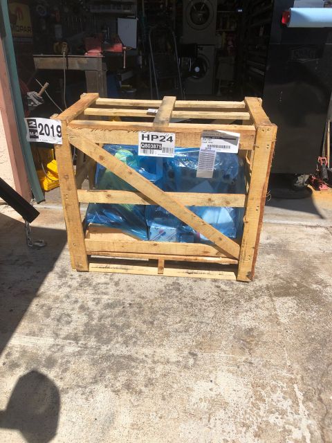 1992 Jeep Wrangler - A wooden crate containing an engine, possibly from 2019, is shown in a workshop setting.