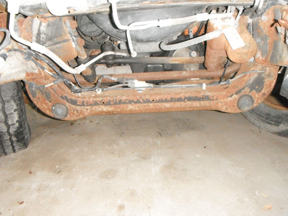 Rusted front suspension components and tire