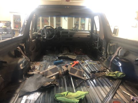1995 Ford Bronco - Disassembled interior of a 1995 Ford Bronco, ready for tailgate repair.