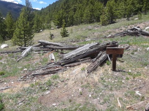 1999 Ford E250 - Remnants of a mining area are visible in a wooded landscape, marked by a historical sign.