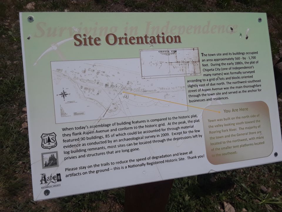 Sign about Chipeta City's site orientation and history, with maps and text