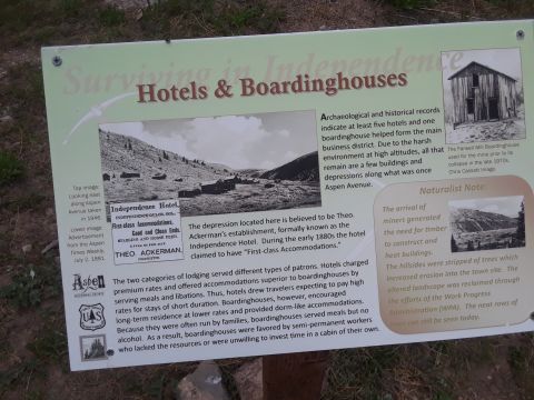 1999 Ford E250 - A historical marker details the history of hotels and boardinghouses in a mountain town, including photographs and text.