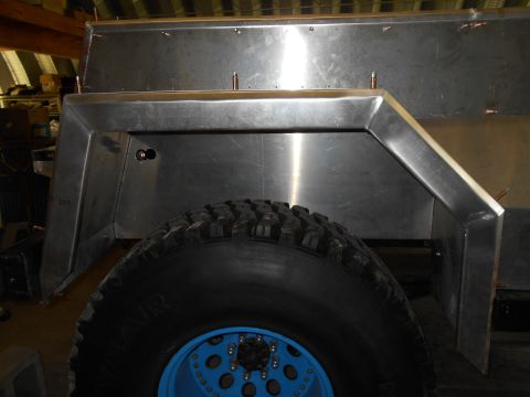 1992 Ford Bronco - The vehicle appears to be undergoing custom metal fabrication, with a focus on the rear wheel well area.
