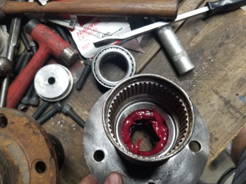 1974 Ford Bronco - Before stabbing the hub onto the spindle, I like to fill the cavity between the bearings with the same hi-temp bearing grease that they're…