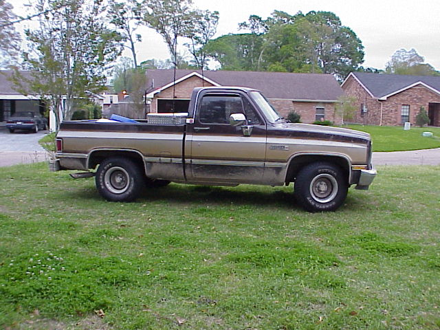 Brown and tan pickup truck, side view