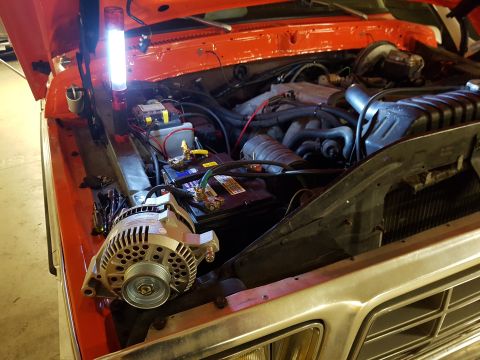 1978 Ford Bronco - Installing a new alternator in the engine bay of a 1978 Ford Bronco.