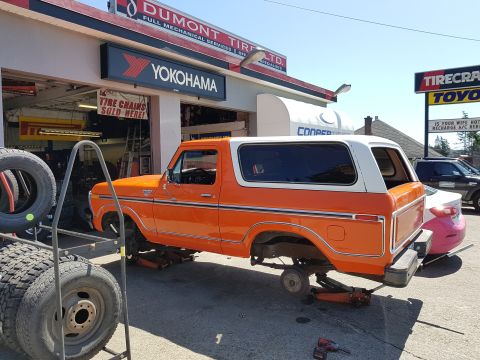 1978 Ford Bronco - This 1978 Ford Bronco is being serviced at a tire shop, with its front wheels removed.