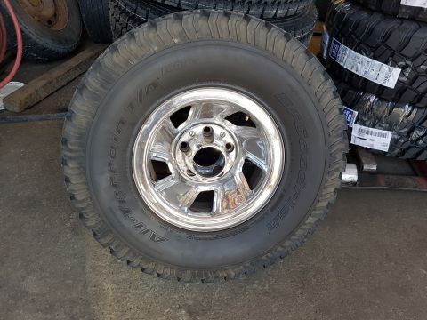 1978 Ford Bronco - Close-up of a BFGoodrich All-Terrain T/A KO tire mounted on a chrome wheel.