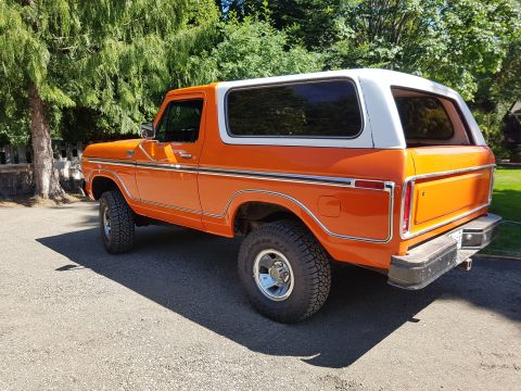 1978 Ford Bronco - This 1978 Ford Bronco is shown from a rear three-quarter angle, highlighting its two-tone paint scheme.