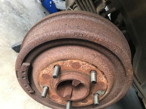 1996 Ford Bronco - This heavily rusted brake drum shows a part number, but no vehicle details are visible.