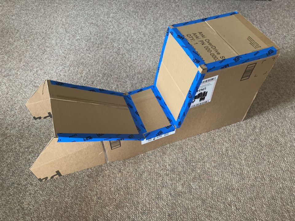 Cardboard box structure taped with blue tape