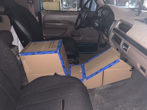 1996 Ford Bronco - Interior view of a 1996 Ford Bronco filled with cardboard boxes.