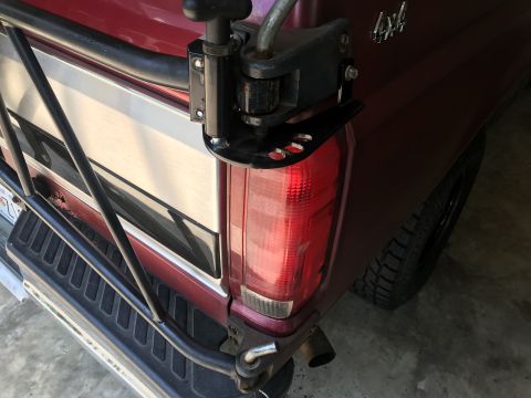 1994 Ford Bronco - Rear view of a 1994 Ford Bronco showing the bumper and tire carrier assembly.