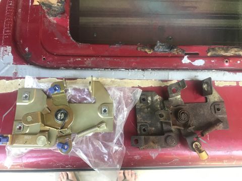 1994 Ford Bronco - Comparison of a new and old tailgate latch mechanism for a vehicle.