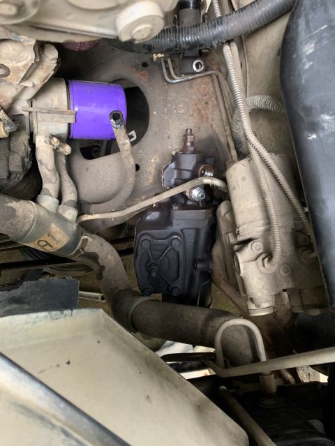 1996 Ford Bronco - This image shows a close-up view of a vehicle's steering gear box and associated plumbing.