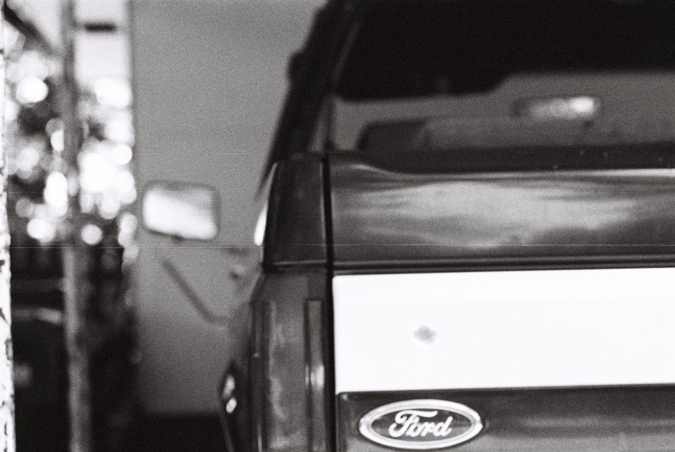 Rear view of a Ford pickup truck with the Ford emblem.