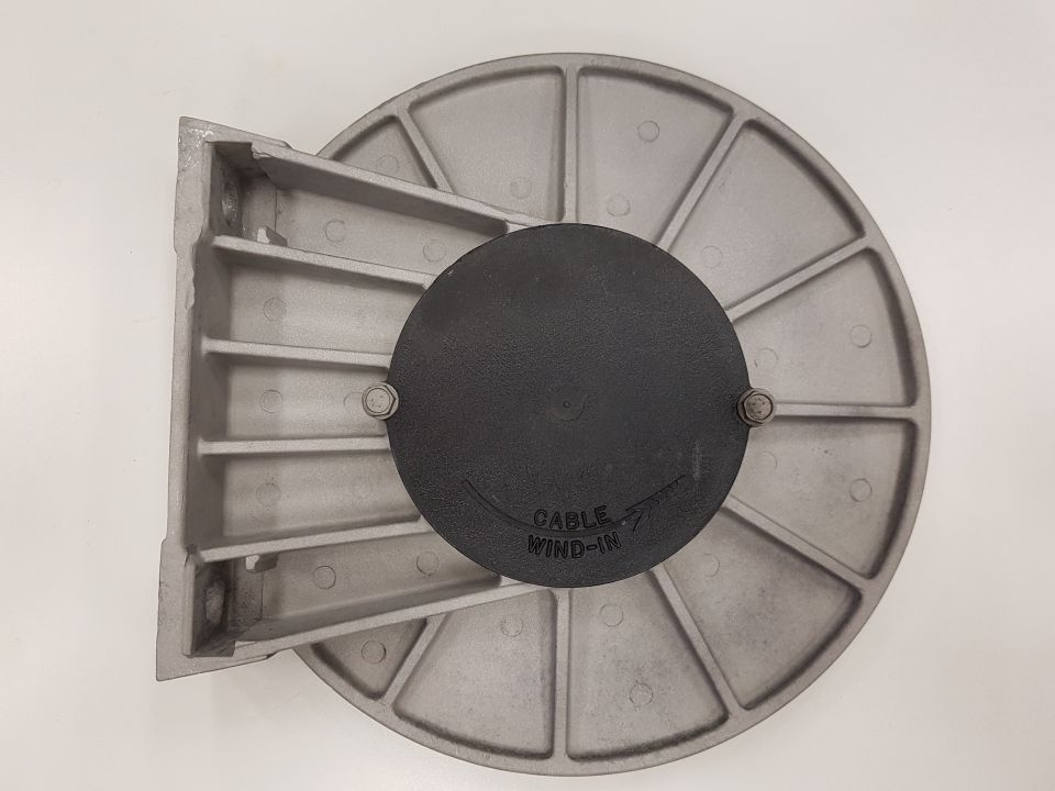 Overhead view of a silver metal mounting bracket with a black circular cover labeled "CABLE WIND-IN".
