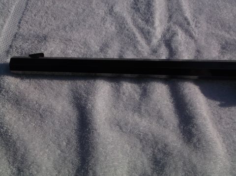 1995 Mercury Grand Marquis - Close-up of a gun barrel, showing the front sight and the dark metal finish.