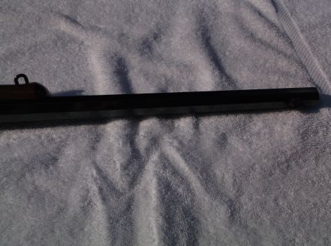 1995 Mercury Grand Marquis - Close-up of a rifle barrel, showing the rear sight assembly.