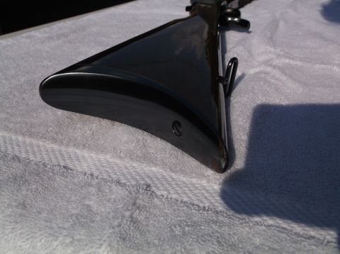 1995 Mercury Grand Marquis - The glossy finish of the rifle stock is visible against a textured towel.