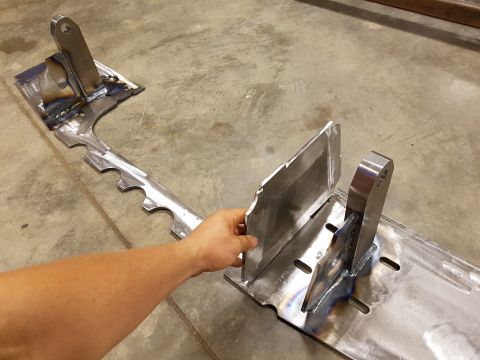 1978 Ford Bronco - A close-up shows a custom-fabricated metal part with welded joints and mounting points.