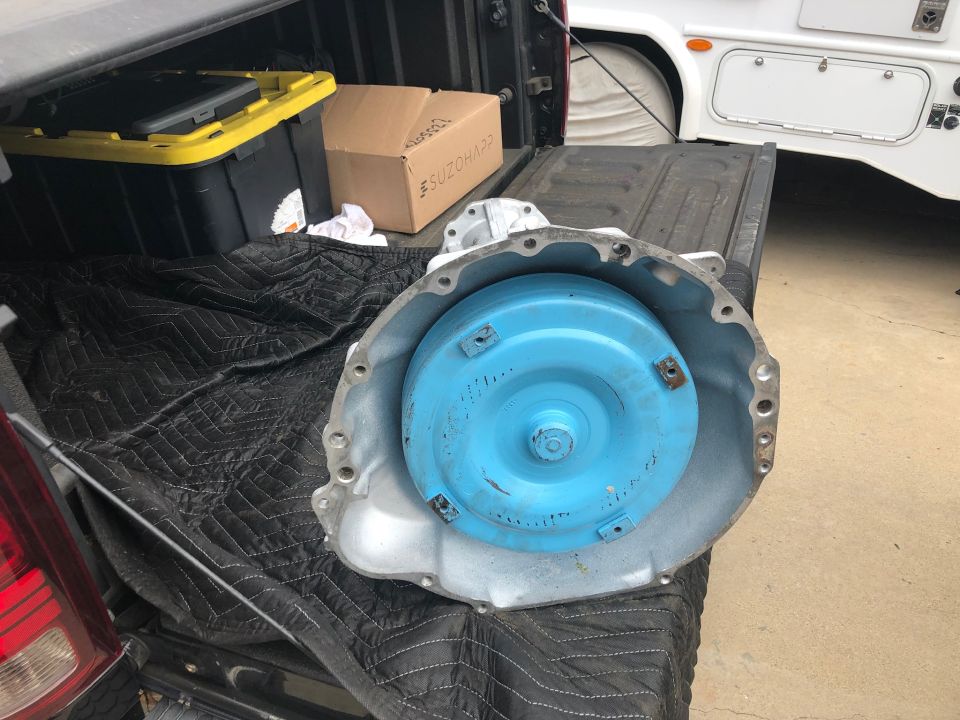 Automatic transmission torque converter and housing, blue converter inside silver housing