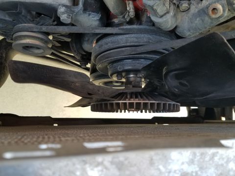 1985 Ford Bronco - Close-up view of an engine's fan and pulley system, showing belts and fan clutch.