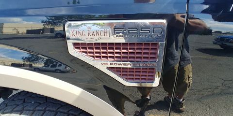 2010 Ford F-250 - The fender emblem clearly shows 'F-250' and 'King Ranch' branding, indicating it's a Ford Super Duty truck.