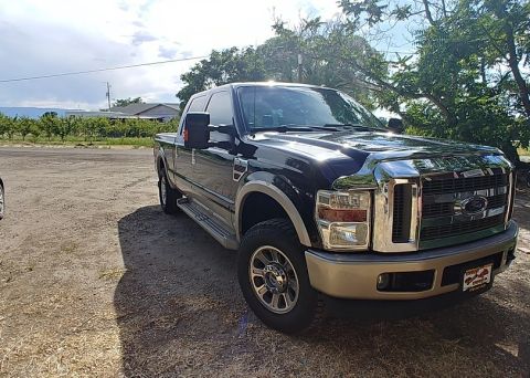 2010 Ford F-250 - This 2010 Ford F-250 Super Duty pickup truck is shown from the front 3/4 angle.