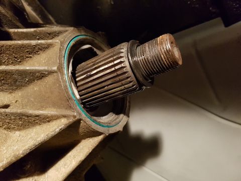 1978 Ford Bronco - Close-up of a splined shaft protruding from a transmission housing.