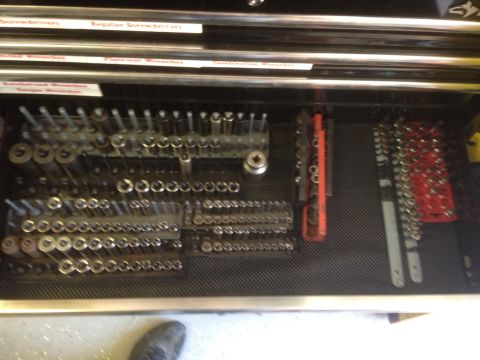 1992 Jeep Wrangler - A well-organized tool drawer displays a variety of sockets and wrenches, ready for use.