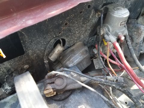 1985 Ford Bronco - Close-up view of the engine bay wiring and electrical components, showing various cables and connectors.