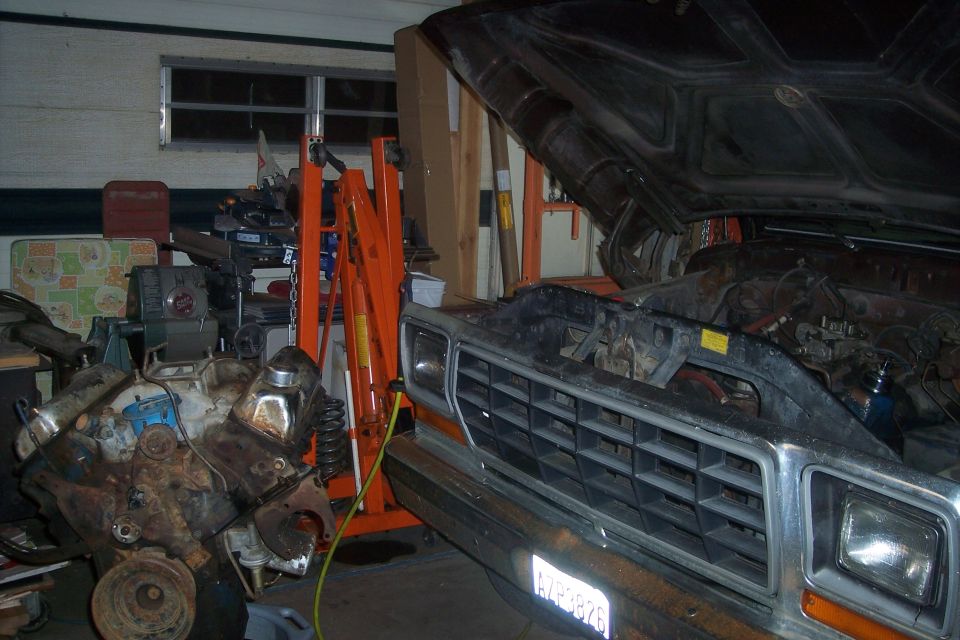 1978 Ford Bronco front with hood open and engine nearby