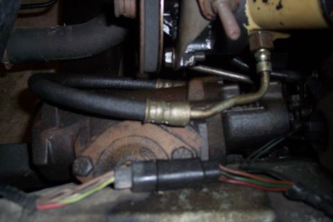 1978 Ford Bronco - Engine component detail with hoses and wiring visible.