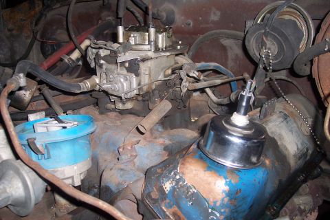 1978 Ford Bronco - Close-up view of an engine bay, showing the carburetor and distributor components.