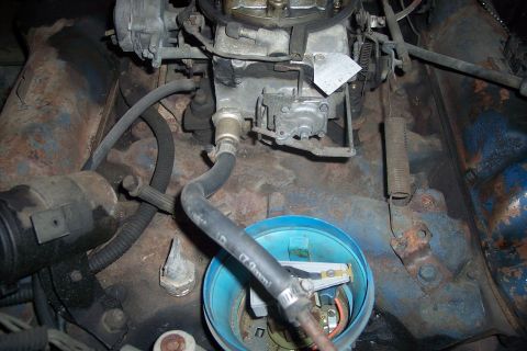 1978 Ford Bronco - Close-up view of an engine bay, showing various mechanical components and hoses.