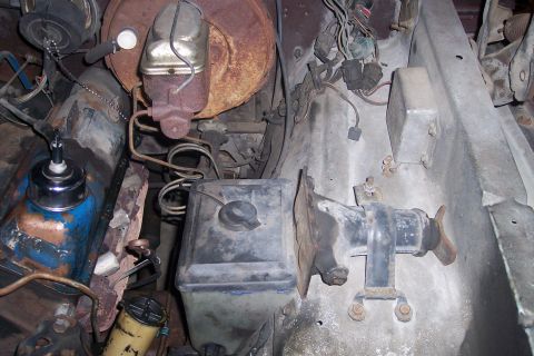 1978 Ford Bronco - Close-up view of engine bay components, including brake system parts and wiring.