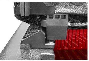 2000 Ford Crown Victoria - Detail of a vehicle's seat adjustment mechanism, showing metal and red plastic components.
