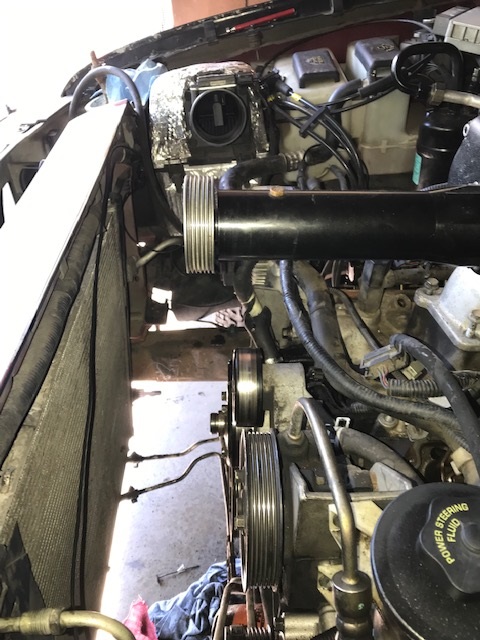 2000 Ford Explorer - Close-up of engine bay components, likely related to a supercharger installation.