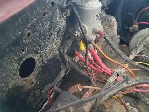 1985 Ford Bronco - Close-up view of a winch solenoid and its associated wiring, red and orange cables.